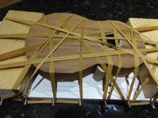 The top is then glued into place whilst being held in the special jig which holds it securely.